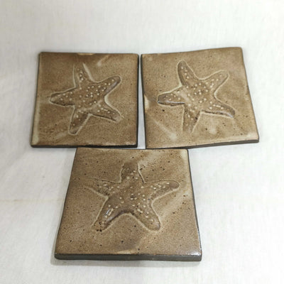 אריחים,10/10,  אריחי קרמיקה, קרם חום מט  בתבליט כוכב