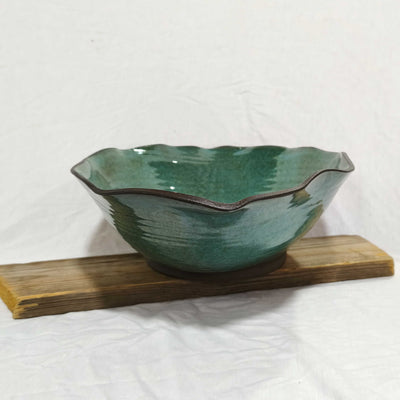 קערת קרמיקה אובלית מסולסלת בכחול