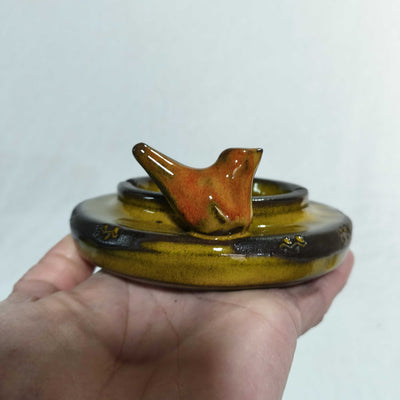 מאפרה עגולה צהובה  עם ציפור